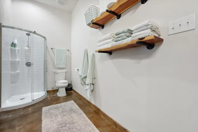 a view of a hallway with shelves