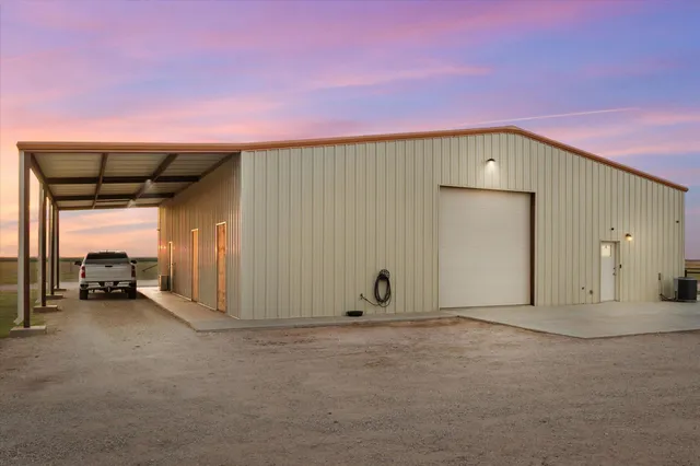 a view of a car garage with a car parked