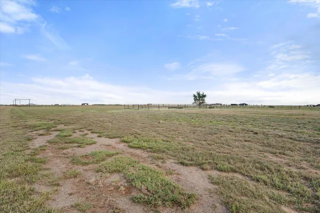 a car parked in front of a field