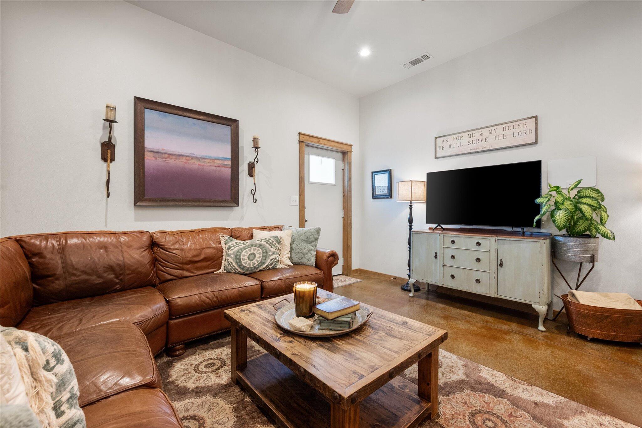 753 Co Road Plainview, TX 79072 - Photo 5 of 39 a living room with furniture and a flat screen tv