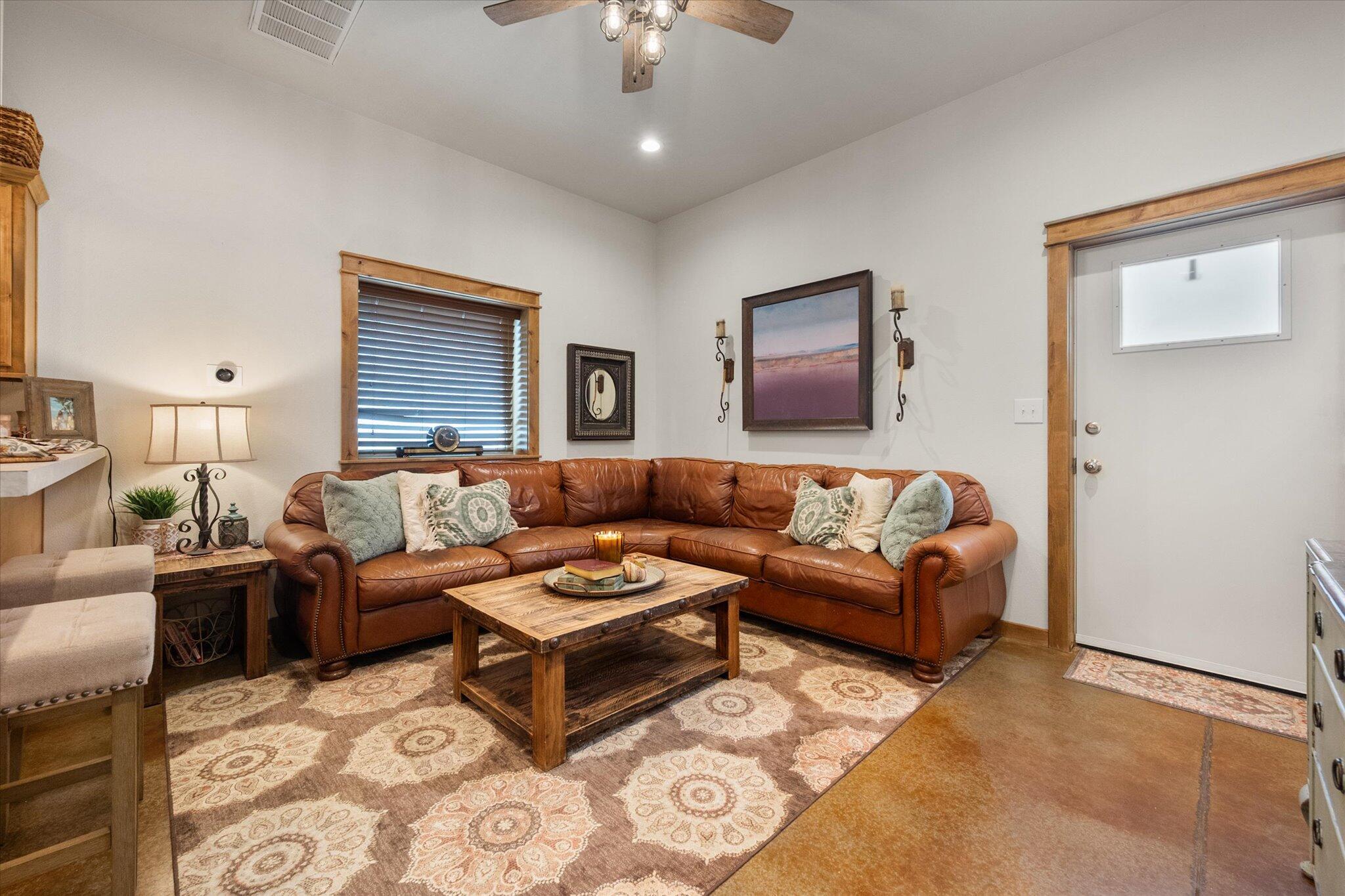 753 Co Road Plainview, TX 79072 - Photo 6 of 39 a living room with furniture and a chandelier
