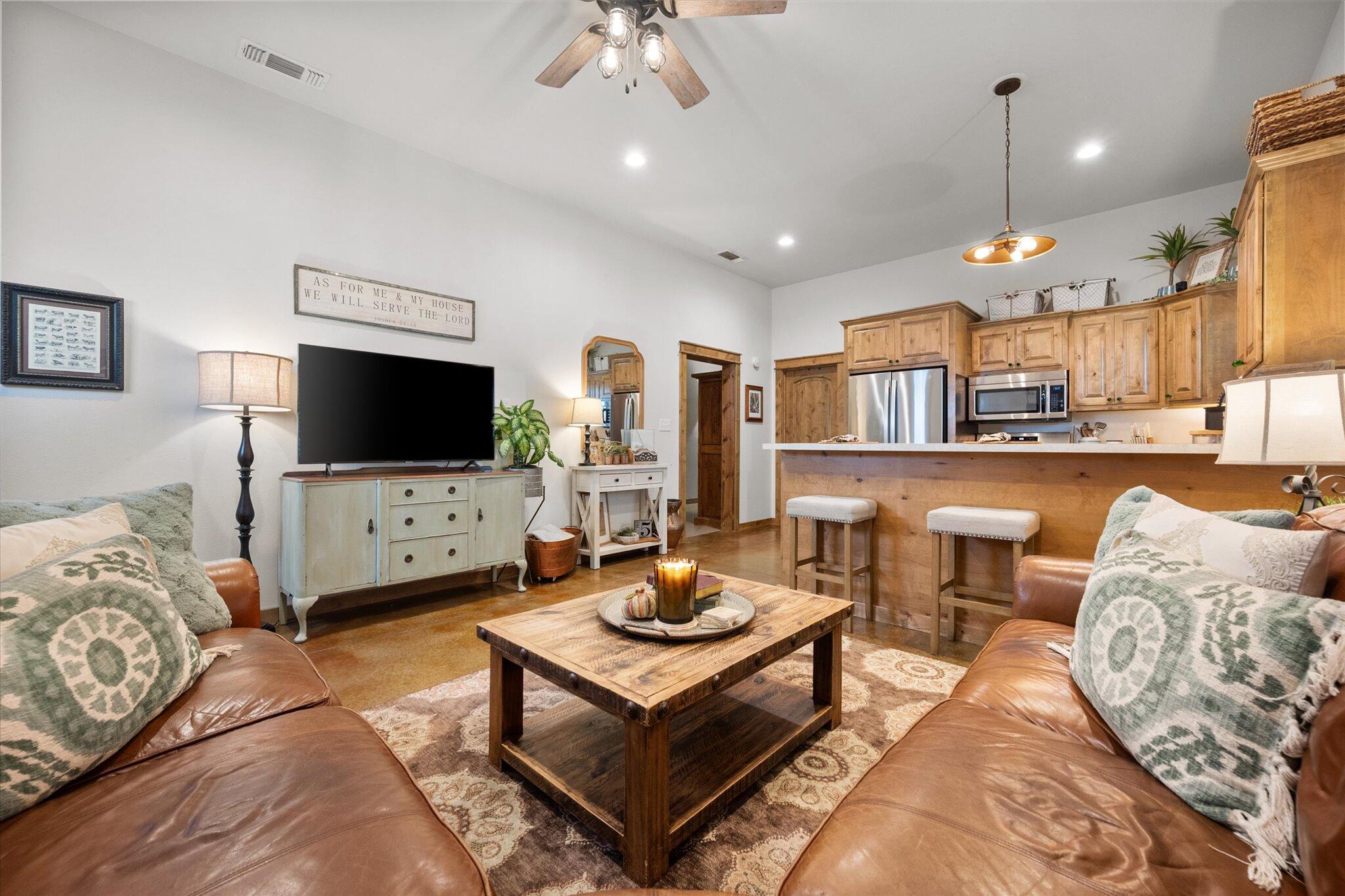 753 Co Road Plainview, TX 79072 - Photo 7 of 39 a living room with furniture and a flat screen tv