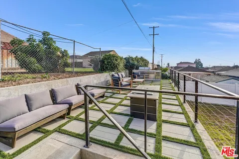 a view of a terrace with couches and potted plants