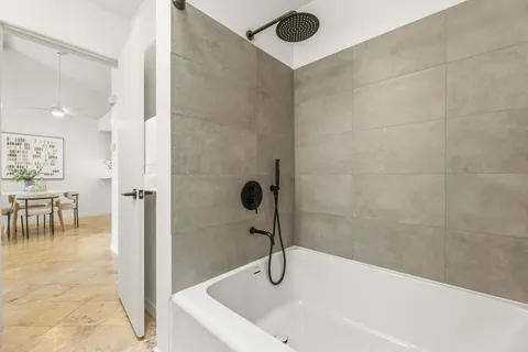a bathroom with a sink and a shower