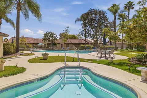 a view of a patio with swimming pool