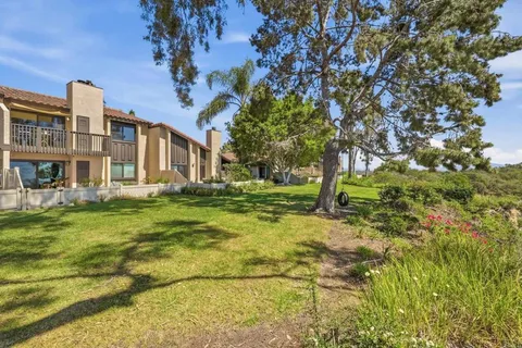 a backyard of a house with lots of green space
