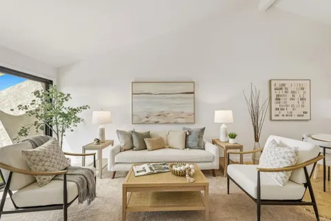 a bedroom with a bed and chair