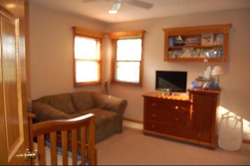 1118 Country Ridge Lane Bolingbrook, IL 60440 - Photo 13 of 16 a living room with furniture and a flat screen tv
