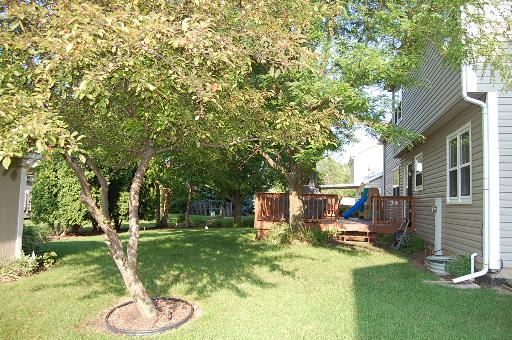 1118 Country Ridge Lane Bolingbrook, IL 60440 - Photo 16 of 16 a backyard of a house with garden and outdoor seating