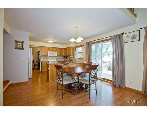 1118 Country Ridge Lane Bolingbrook, IL 60440 - Photo 4 of 16 a view of a dining room with furniture and wooden floor