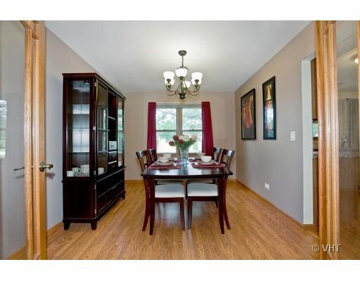 1118 Country Ridge Lane Bolingbrook, IL 60440 - Photo 5 of 16 a view of a dining room with furniture and window