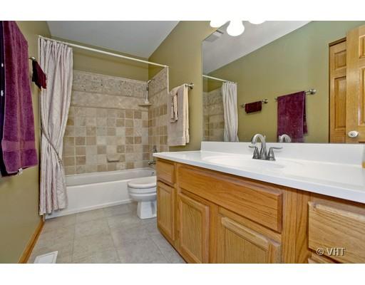 1118 Country Ridge Lane Bolingbrook, IL 60440 - Photo 9 of 16 a bathroom with a granite countertop sink a toilet and shower