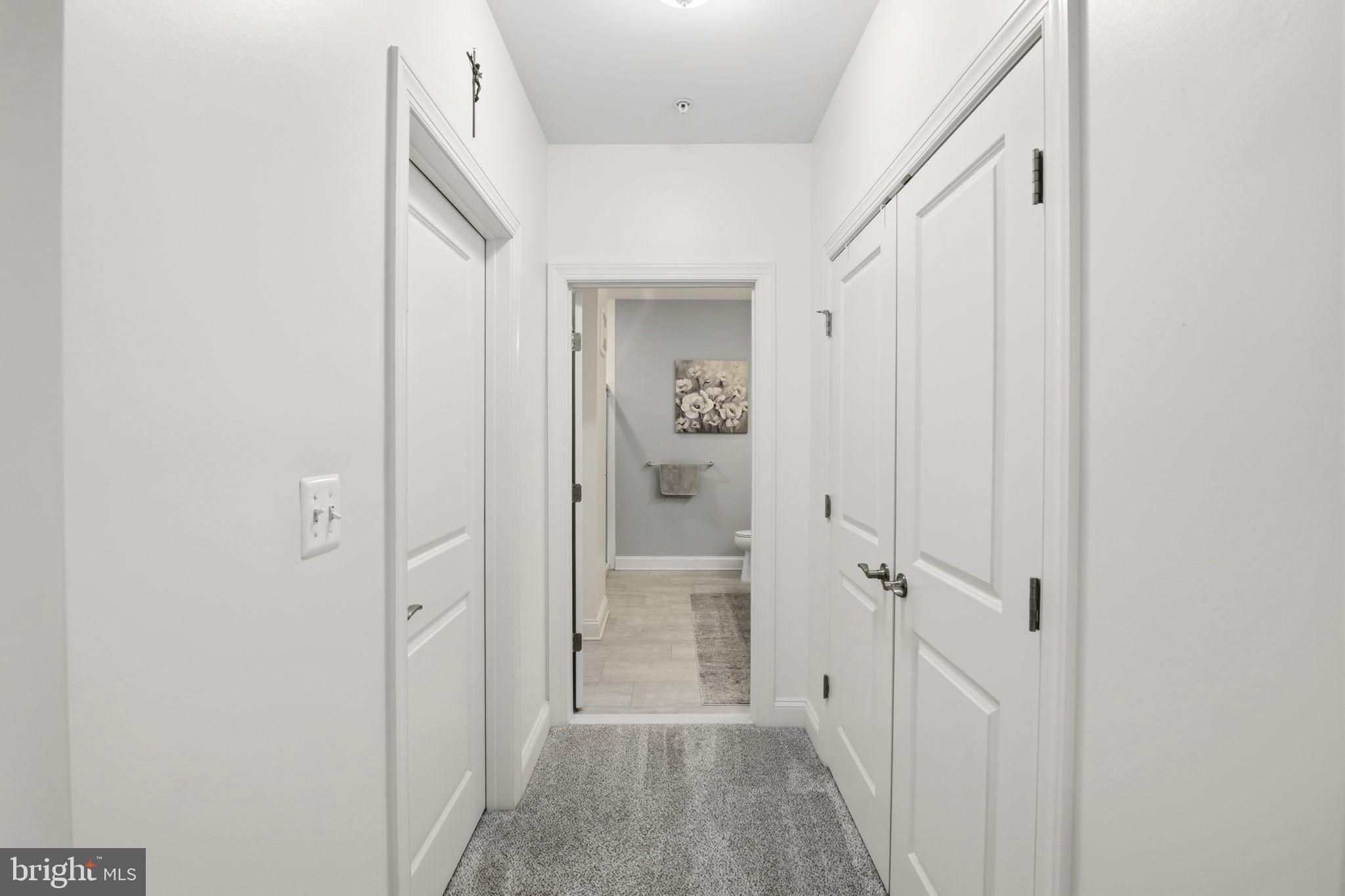 401 Bold Ruler Court, Unit 307 Havre de Grace, MD 21078 - Photo 9 of 32 Hallway to en suite w/ 2 walk in closets