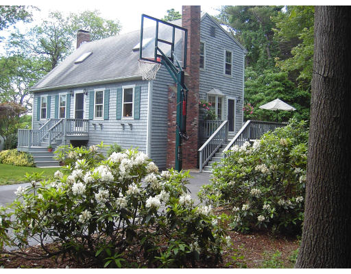 42 Marion Road Scituate, MA 02066 - Photo 1 of 4 a front view of a house with a yard and fountain
