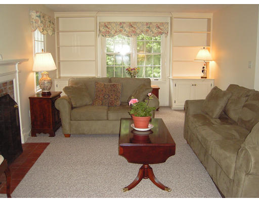 42 Marion Road Scituate, MA 02066 - Photo 2 of 4 a living room with furniture and a large window
