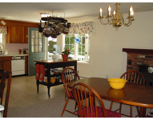 42 Marion Road Scituate, MA 02066 - Photo 3 of 4 a view of a dining room with furniture and chandelier