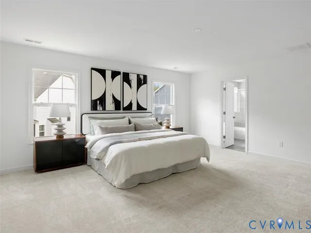 a bed room with a bed and a night stand