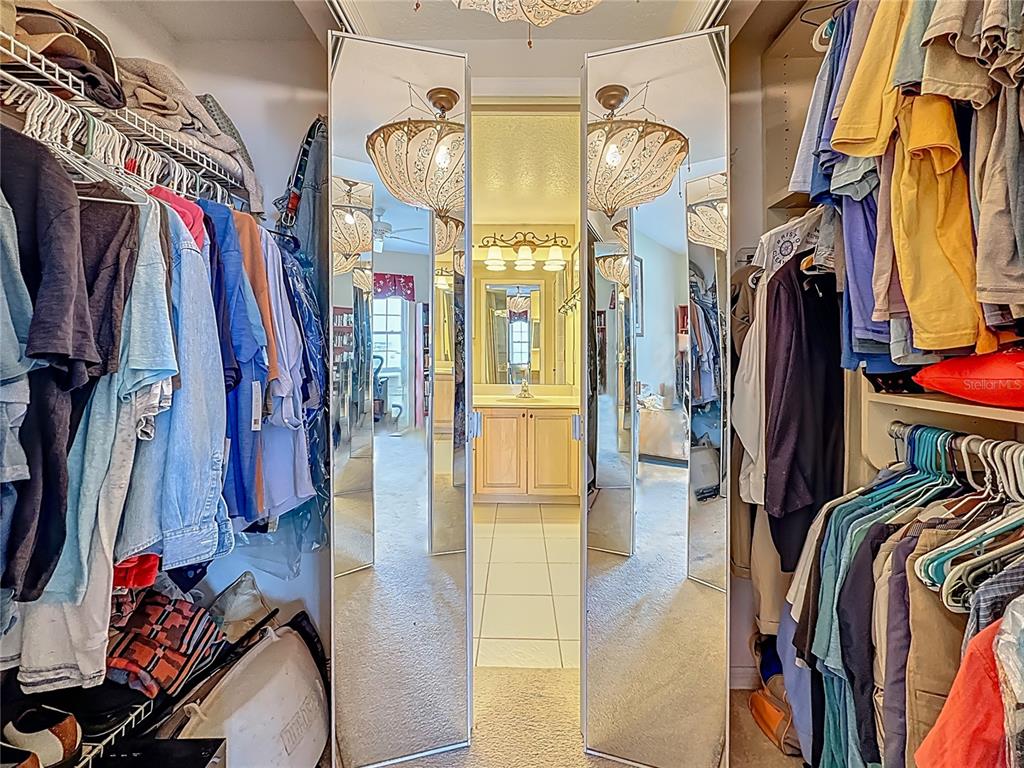 399 150th Avenue, Unit 317 Madeira Beach, FL 33708 - Photo 25 of 96 a view of walk in closet with clothes