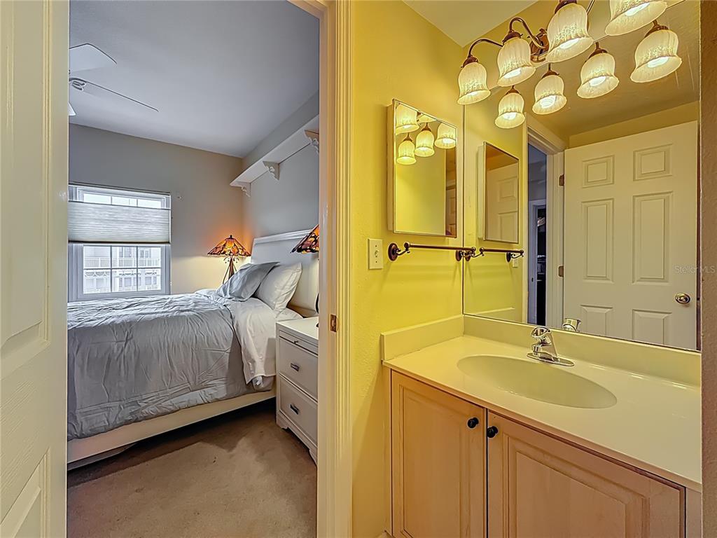 399 150th Avenue, Unit 317 Madeira Beach, FL 33708 - Photo 33 of 96 a en suite bathroom with a sink and a mirror