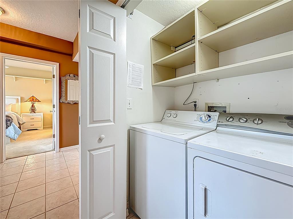 399 150th Avenue, Unit 317 Madeira Beach, FL 33708 - Photo 38 of 96 a utility room with dryer and washer