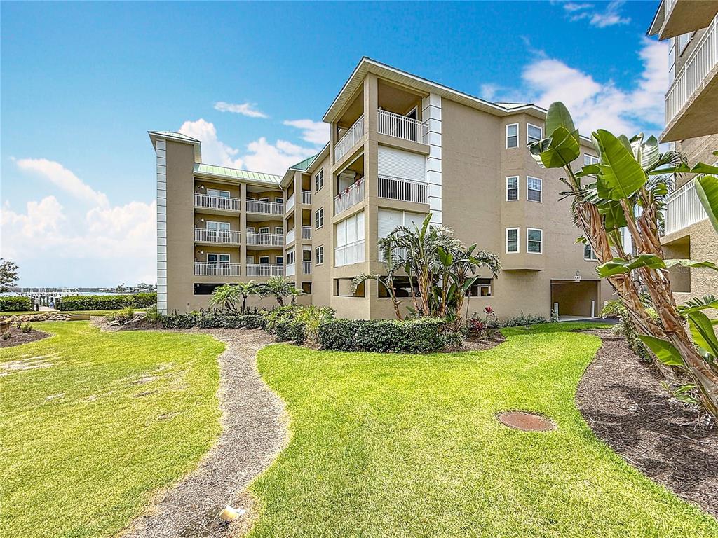 399 150th Avenue, Unit 317 Madeira Beach, FL 33708 - Photo 52 of 96 a view of a house with a swimming pool