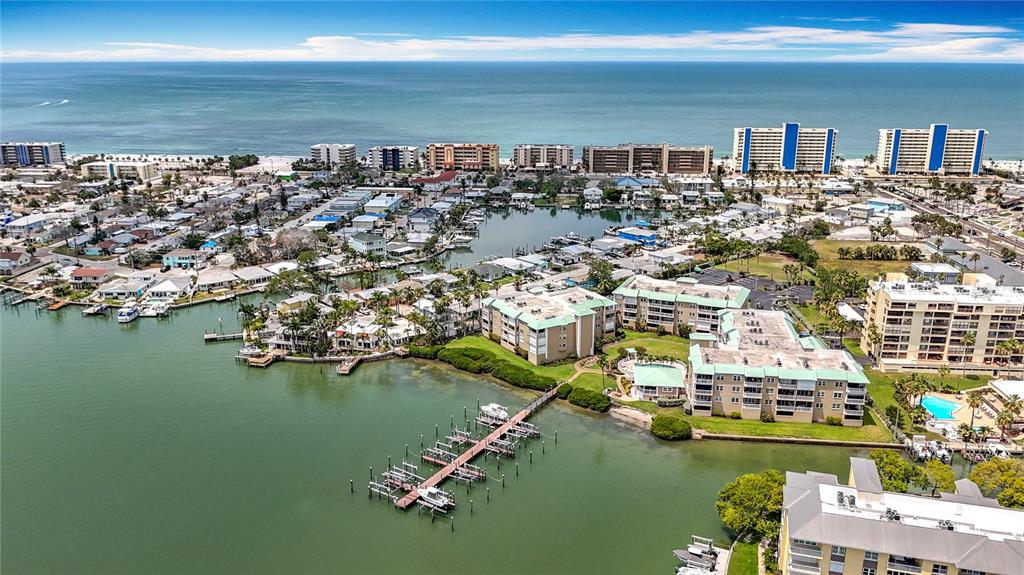 399 150th Avenue, Unit 317 Madeira Beach, FL 33708 - Photo 92 of 96 an aerial view of residential houses with outdoor space