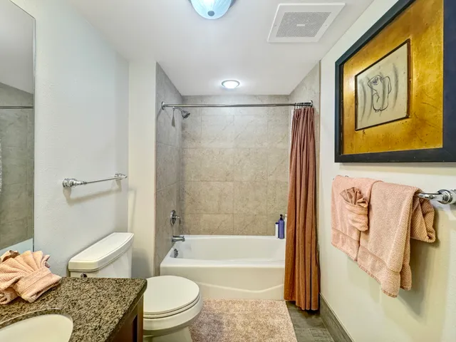 a bathroom with a toilet sink and bathtub