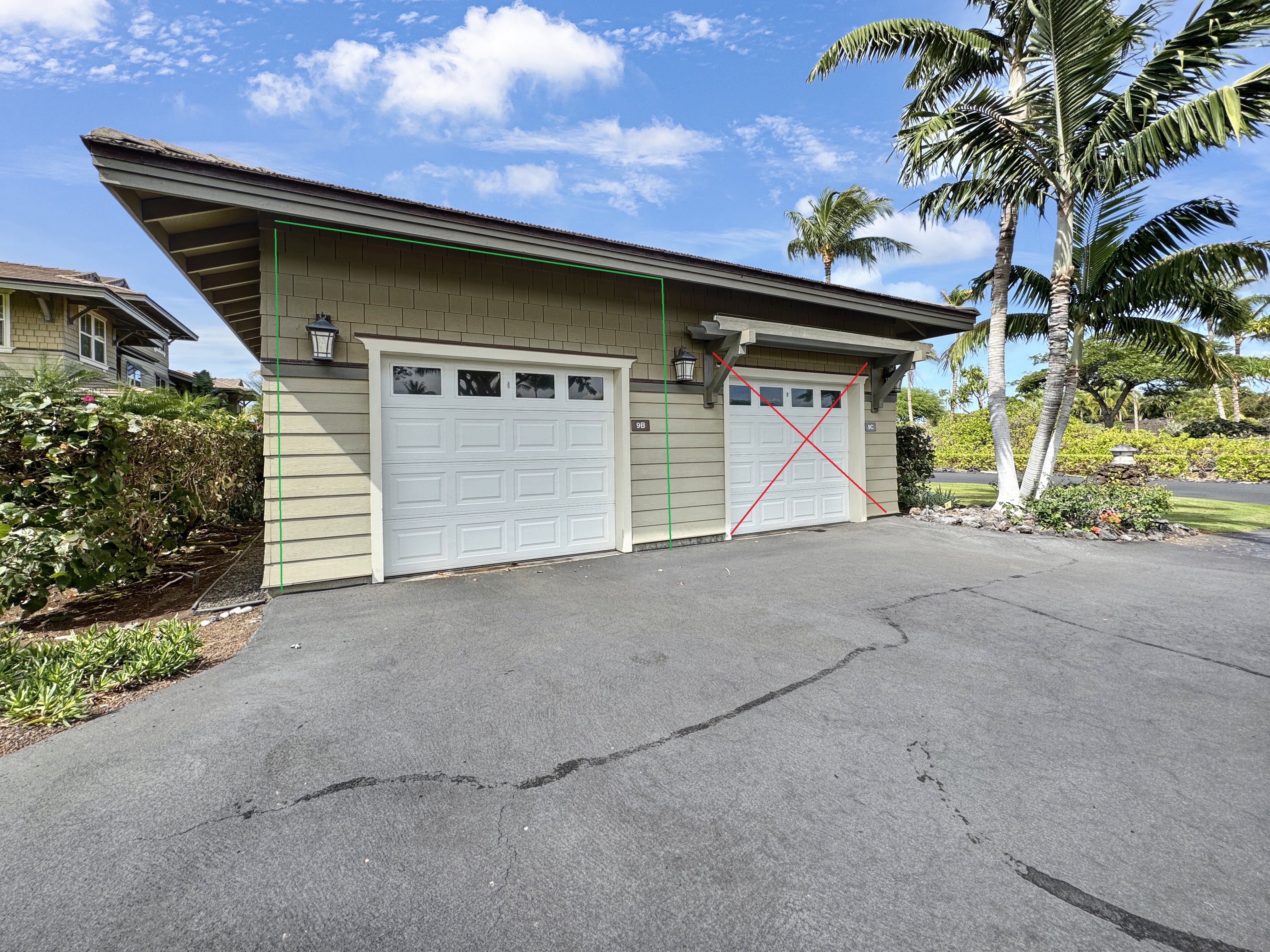 69-1033 Nawahine Place, Unit 9B Waikoloa, HI 96738 - Photo 17 of 24 a front view of a house with a yard and garage