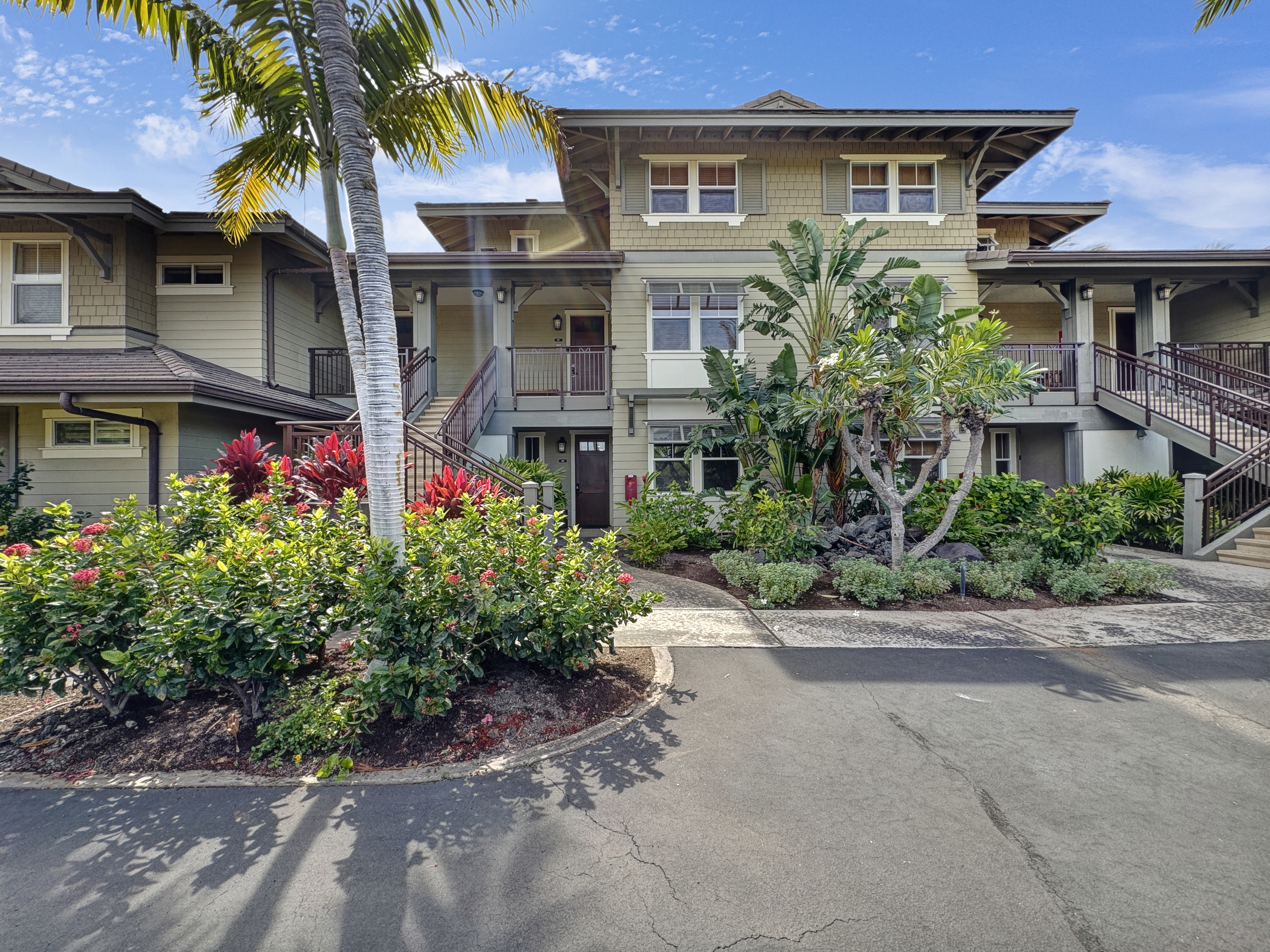 69-1033 Nawahine Place, Unit 9B Waikoloa, HI 96738 - Photo 19 of 24 a front view of a house with a garden