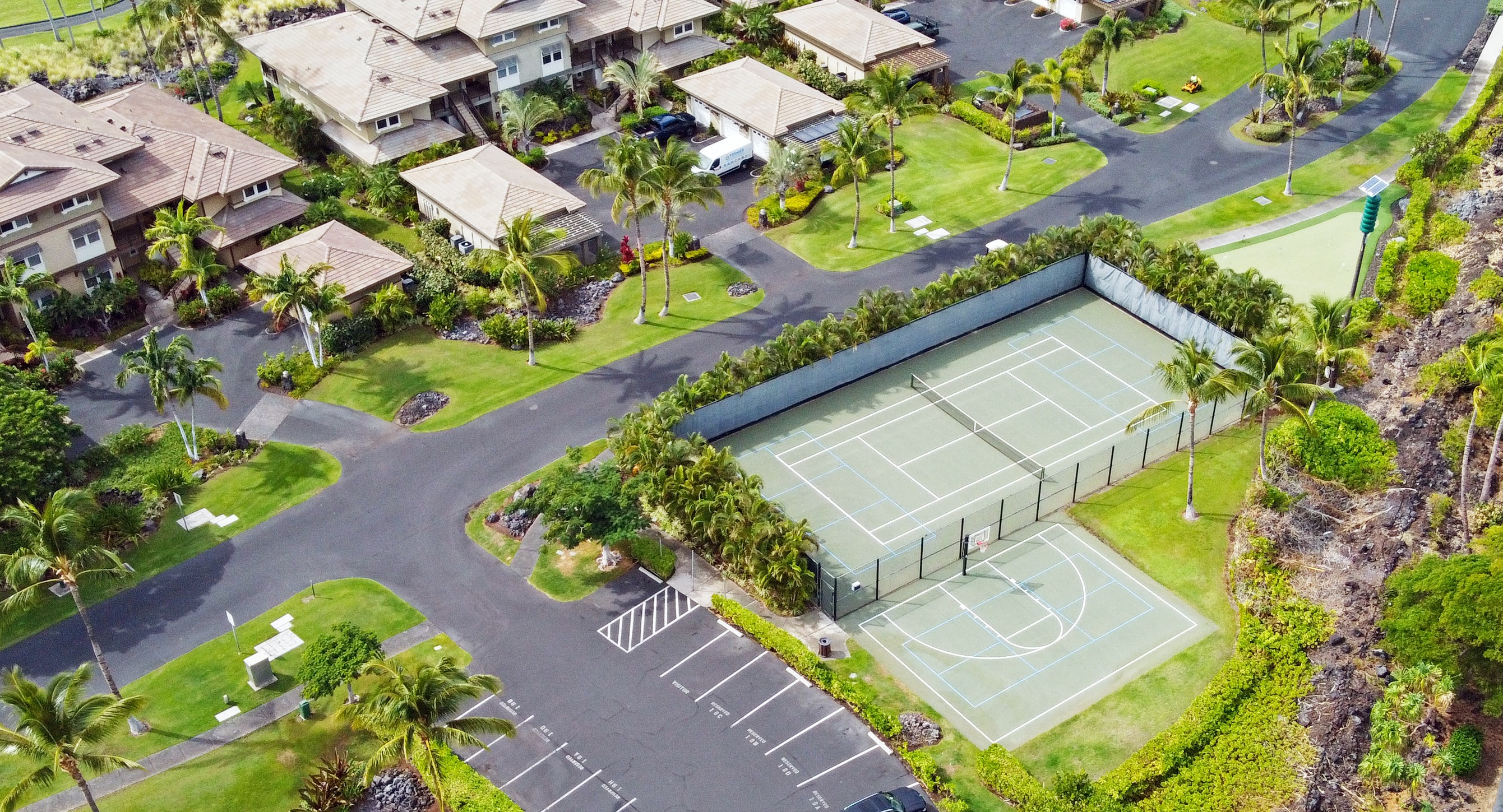 69-1033 Nawahine Place, Unit 9B Waikoloa, HI 96738 - Photo 22 of 24 an aerial view of a house with a yard and potted plants