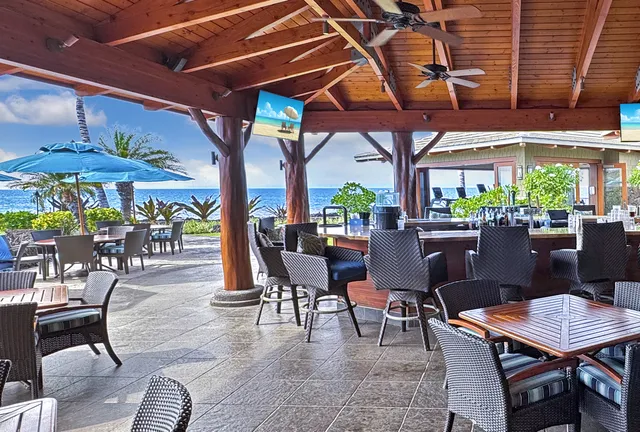 a view of a dining table and chairs in patio