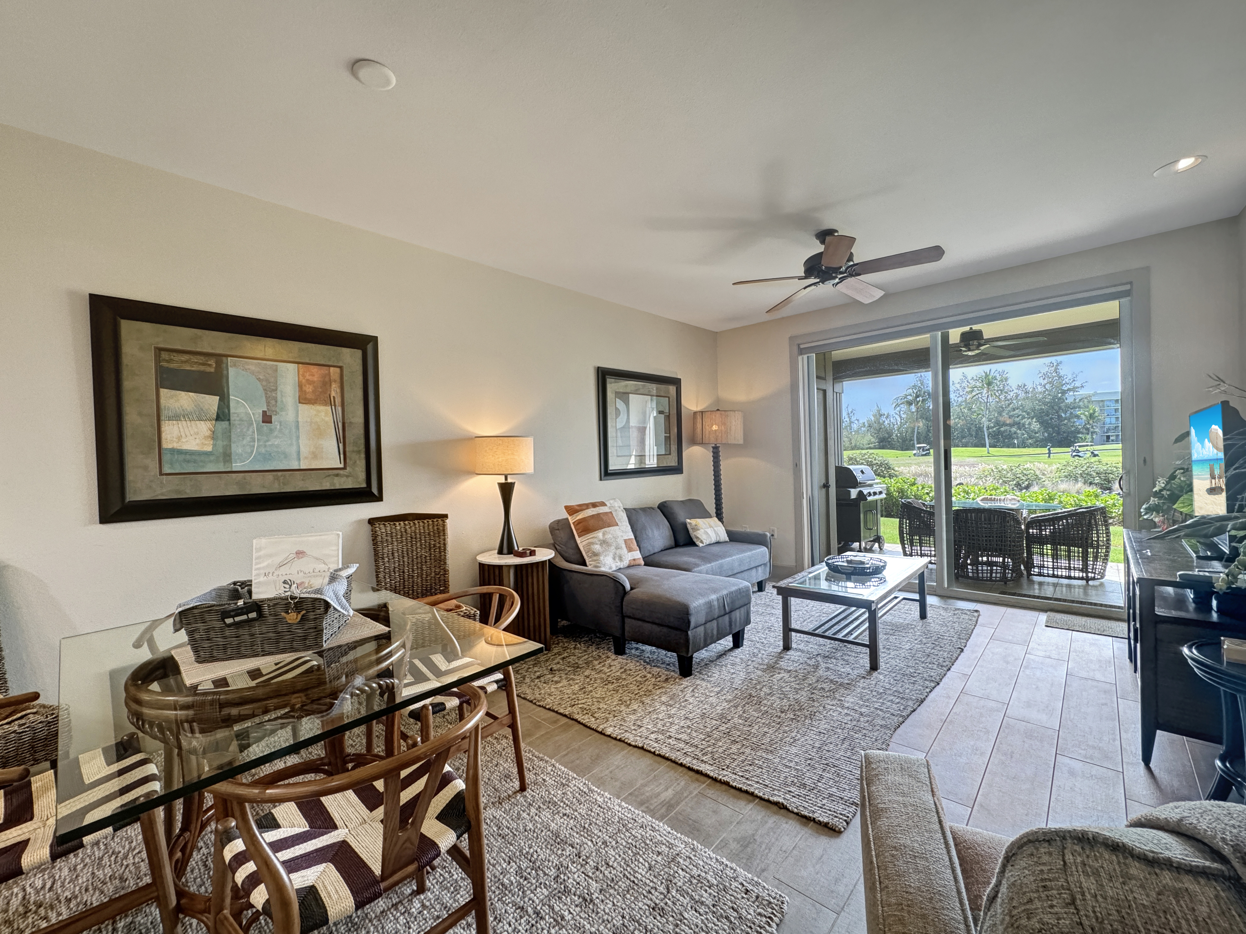 69-1033 Nawahine Place, Unit 9B Waikoloa, HI 96738 - Photo 7 of 24 a living room with furniture and a large window