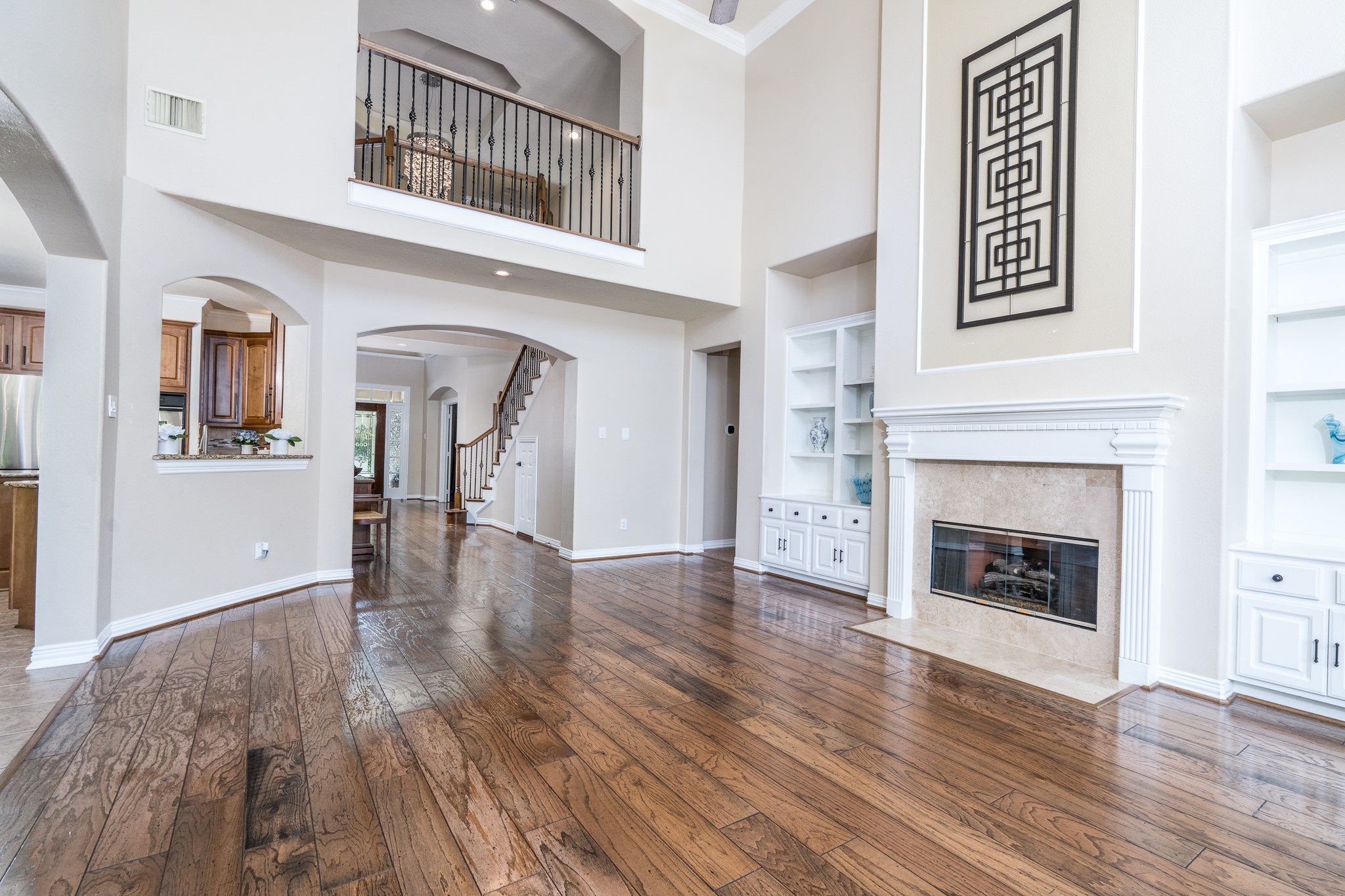 5914 Oakmoss Trail Spring, TX 77379 - Photo 9 of 50 Another view of the living room back towards the extended foyer and the primary suite just around the corner!