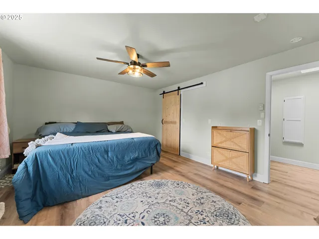 a bedroom with a bed and a table