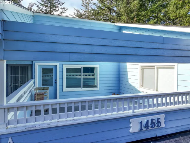 a view of a door and wooden floor