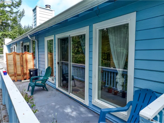 a view of two chairs in the balcony