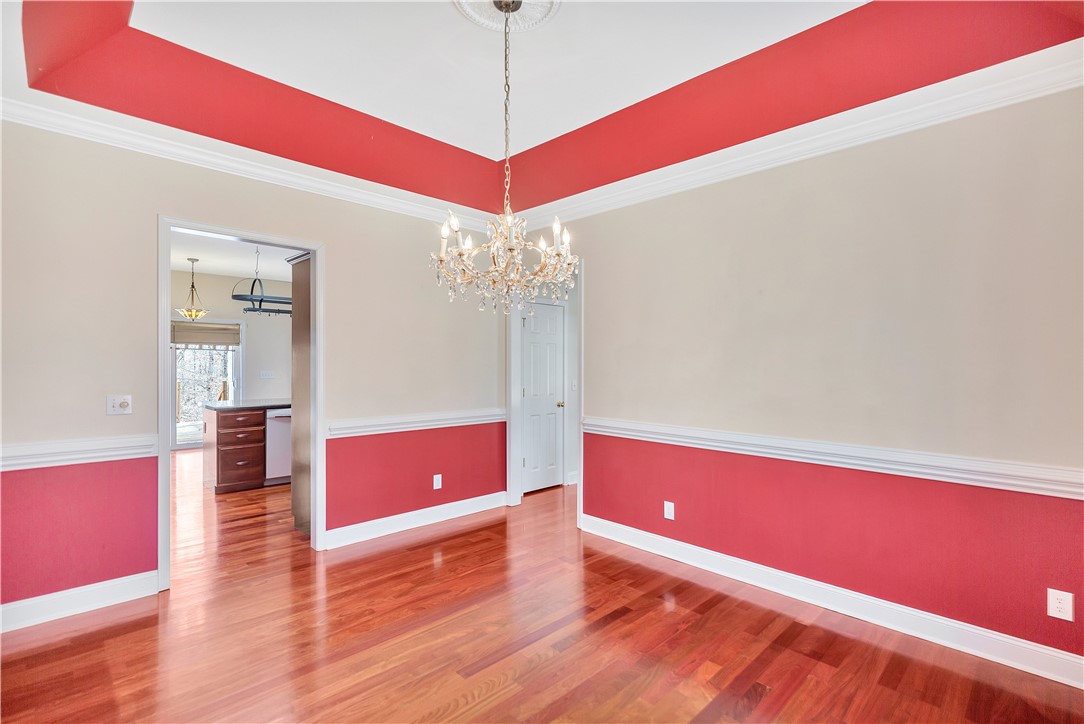 1432 Hunters Trail Anderson, SC 29625 - Photo 13 of 35 This formal dining space features rich hardwood floors and elegant crown molding, ideal for memorable gatherings.