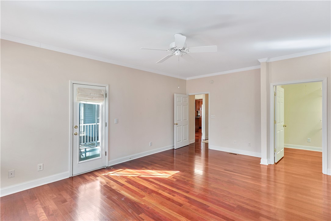 1432 Hunters Trail Anderson, SC 29625 - Photo 15 of 35 This airy room features rich hardwood flooring and a private balcony, perfect for serene mornings or peaceful evenings.