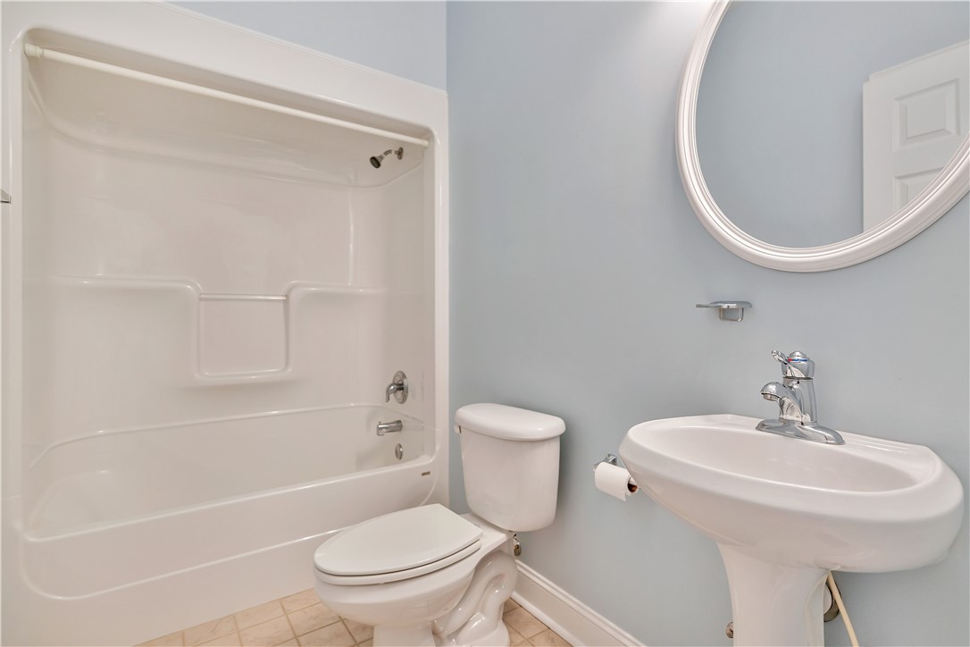 1432 Hunters Trail Anderson, SC 29625 - Photo 20 of 35 This bathroom features a sleek pedestal sink and a clean tub-shower combination.