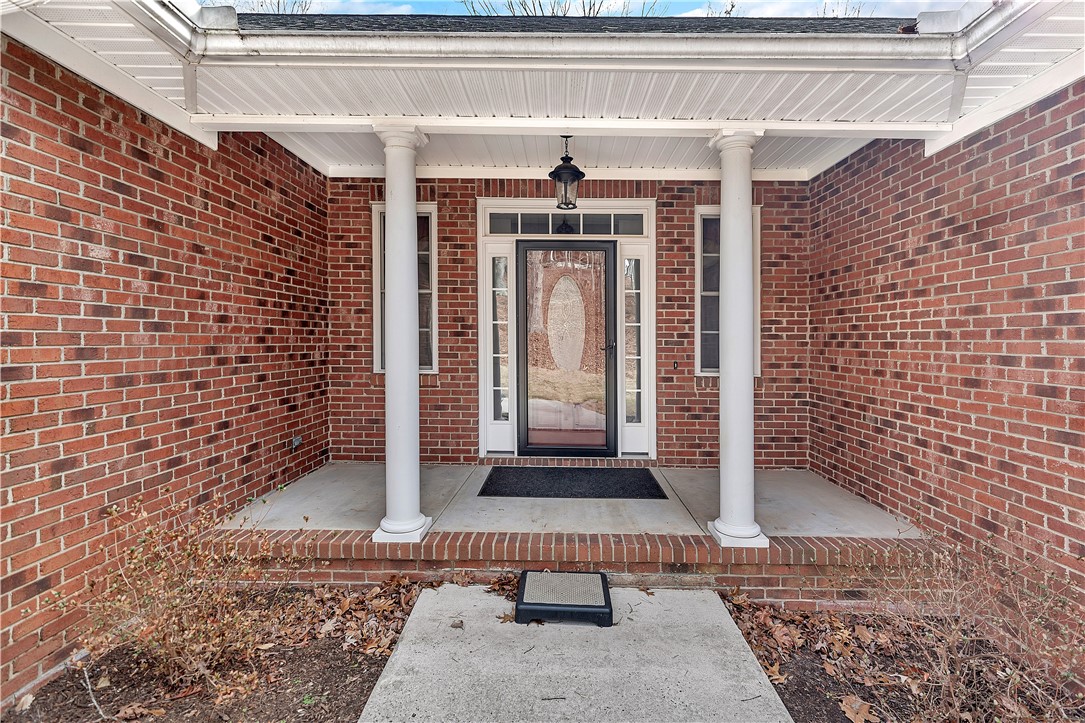 1432 Hunters Trail Anderson, SC 29625 - Photo 2 of 35 An inviting front entry welcomes you home, boasting classic brick and elegant pillars.