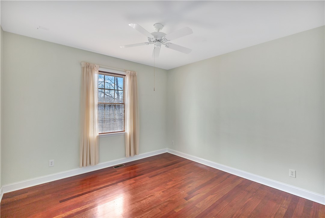 1432 Hunters Trail Anderson, SC 29625 - Photo 21 of 35 This bright room features rich hardwood flooring and a refreshing ceiling fan for comfort.