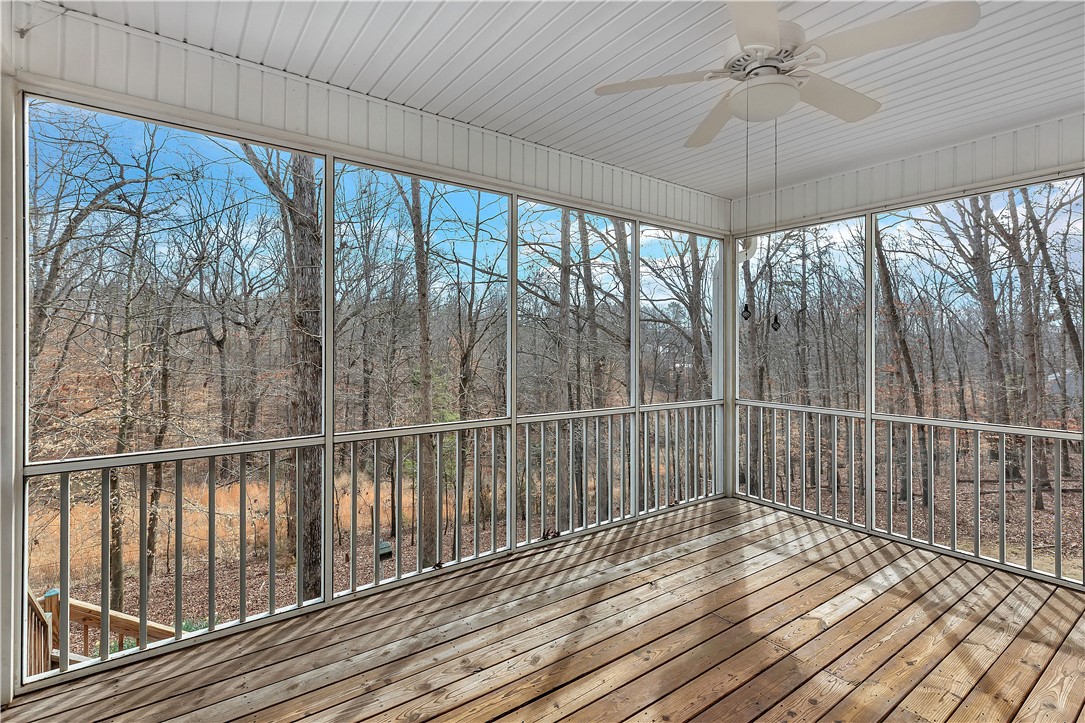 1432 Hunters Trail Anderson, SC 29625 - Photo 23 of 35 Enjoy nature's beauty from this screened-in porch with durable wood flooring and an outdoor ceiling fan.
