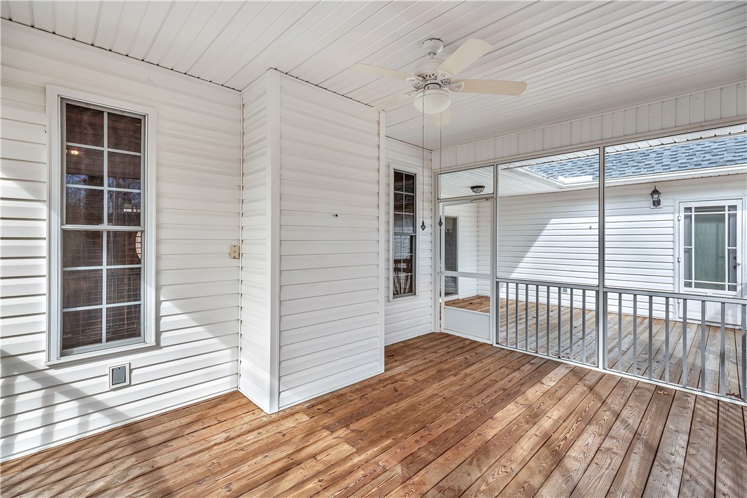 1432 Hunters Trail Anderson, SC 29625 - Photo 24 of 35 This outdoor space features durable wood flooring and screened enclosures for comfortable living.