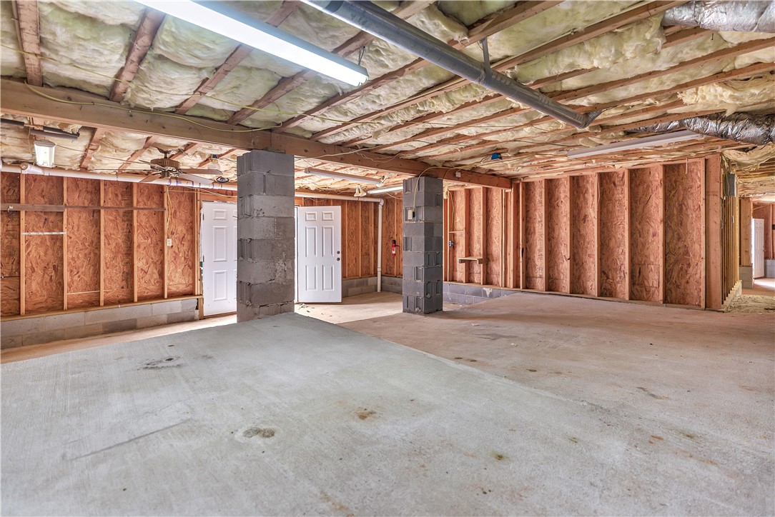 1432 Hunters Trail Anderson, SC 29625 - Photo 27 of 35 This spacious unfinished basement offers endless possibilities for future customization.