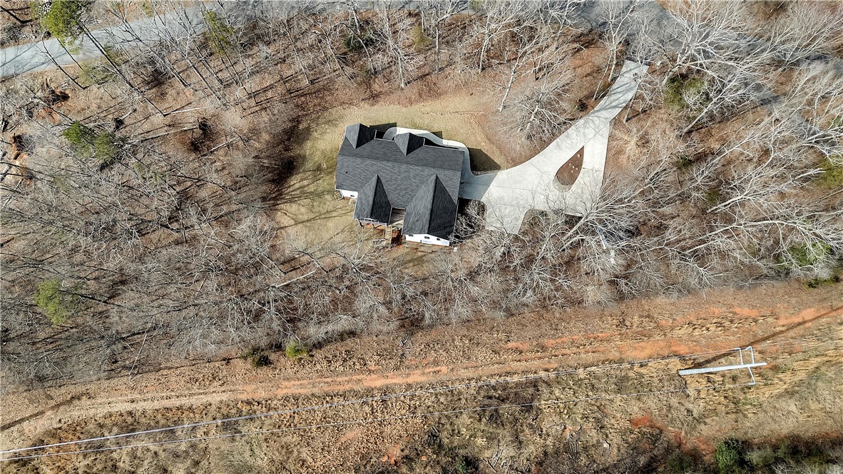 1432 Hunters Trail Anderson, SC 29625 - Photo 33 of 35 This secluded residence offers a private setting surrounded by nature's beauty and an expansive driveway.