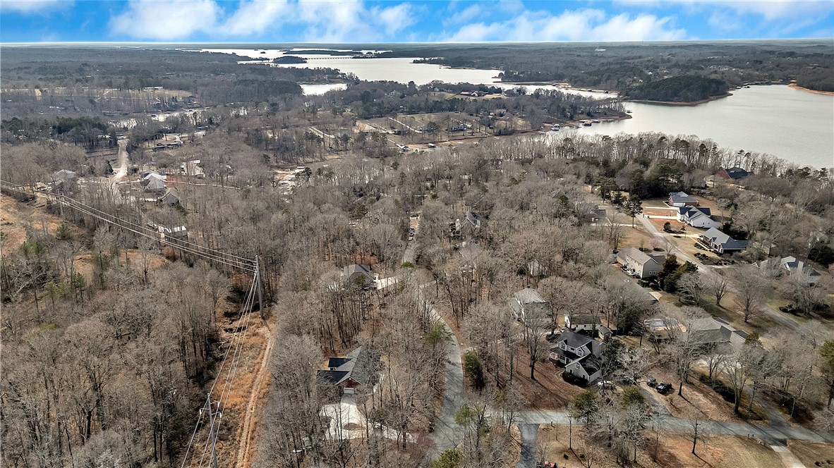1432 Hunters Trail Anderson, SC 29625 - Photo 34 of 35 This elevated view captures a serene lakeside community nestled among mature trees.