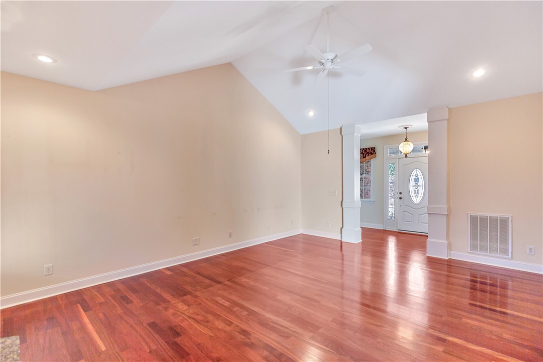 1432 Hunters Trail Anderson, SC 29625 - Photo 7 of 35 Bright and airy interior space featuring polished hardwood floors and high vaulted ceilings.