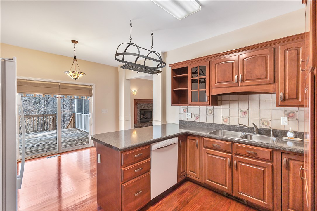 1432 Hunters Trail Anderson, SC 29625 - Photo 8 of 35 This spacious kitchen offers ample cabinetry, modern appliances, and convenient access to the outdoor deck.