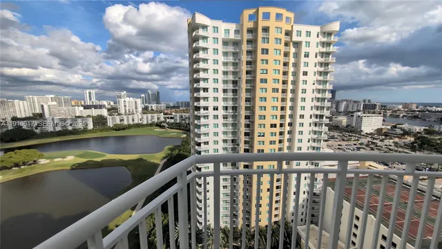 a view of a lake with a multi story building