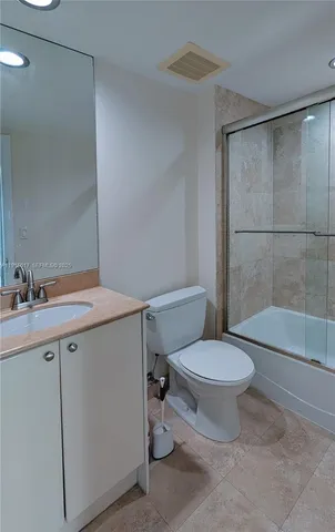 an aerial view of a house with a garden and trees